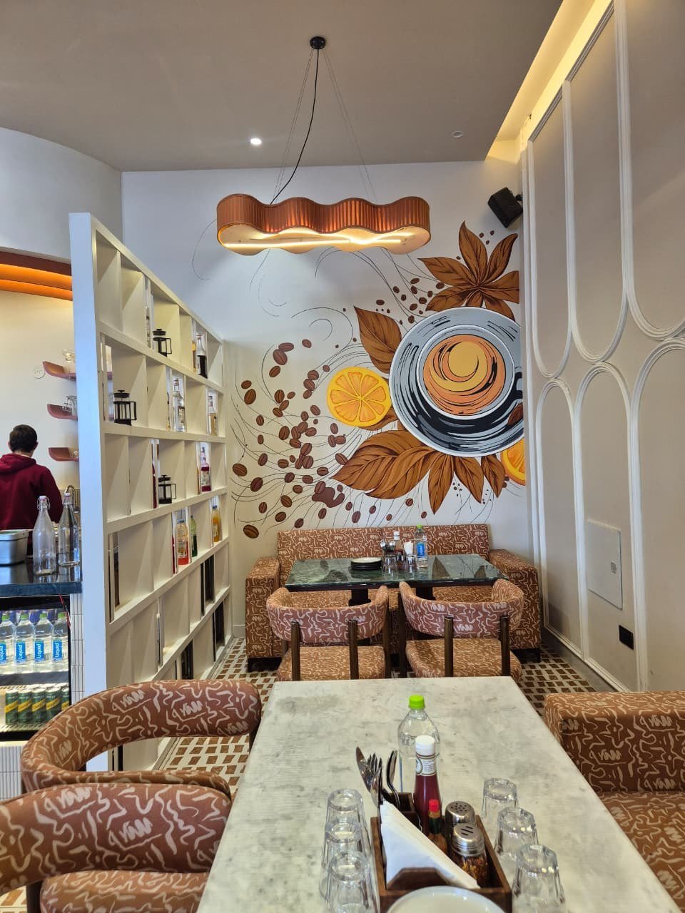 Illustrated coffee mural inside a café