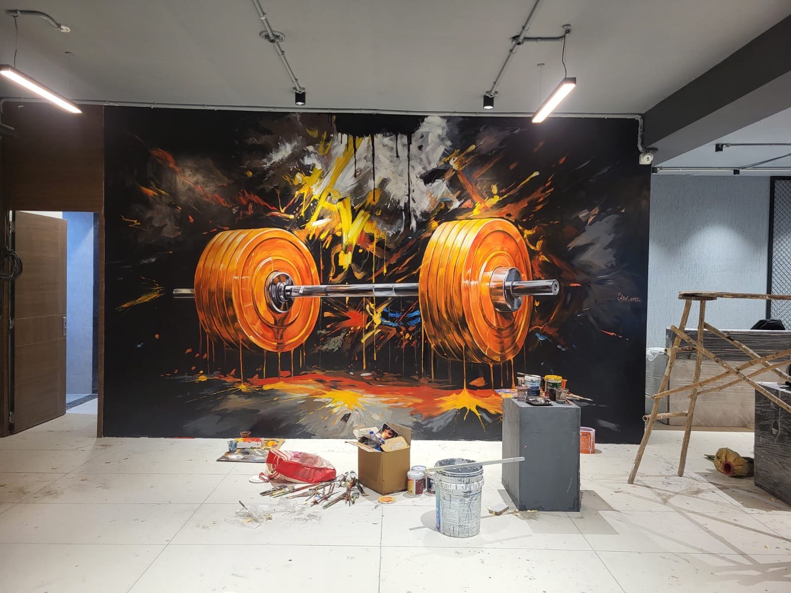 Mural of weightlifting plates in motion